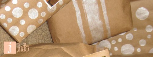 Gifts wrapped in kraft paper and painted