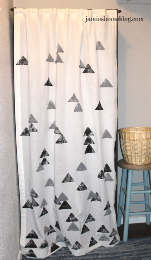 disguise ugly storage shelves with a curtain